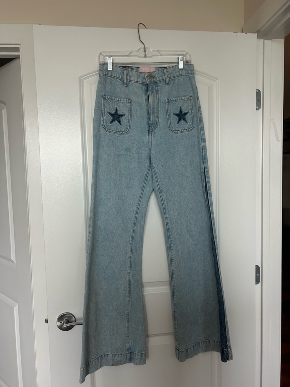 REVICE Light Blue Wide-Leg Jeans with Star Pocket Detail